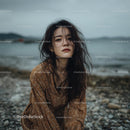Pensive Woman in Autumn Dress by the Seaside