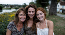 Mother with Daughters in a Tranquil Countryside Setting