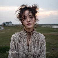Bohemian Woman in Serene Countryside Landscape