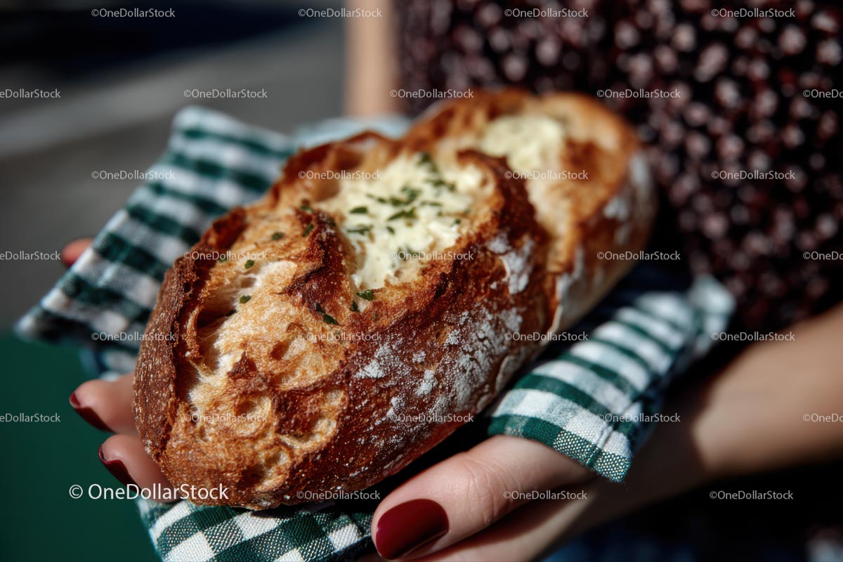 Artisanal Loaf with Golden Crust and Fresh Herbs