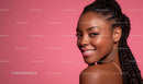 Smiling Woman with Braided Hair on Pink Background