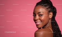 Smiling Woman with Braided Hair on Pink Background