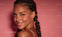 Smiling Woman with Braided Hair Posing Against Pink Background