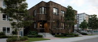 Modern Urban Building with Wooden Facade and Green Surroundings