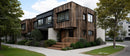 Modern Wooden Facade House with Green Landscaping