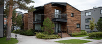 Modern Wooden Facade Residential Building with Greenery