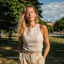 Smiling Woman in a Sunlit Park with Lush Greenery