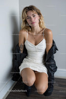 Fashionable Woman in White Dress with Black Jacket