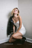 Tattooed Model in White Dress and Black Jacket