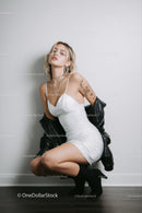 Fashionable Woman in White Dress with Black Jacket