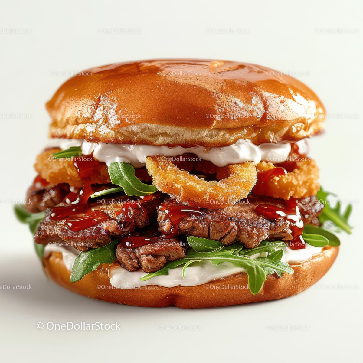 Gourmet Steak Burger with Arugula and Onion Rings