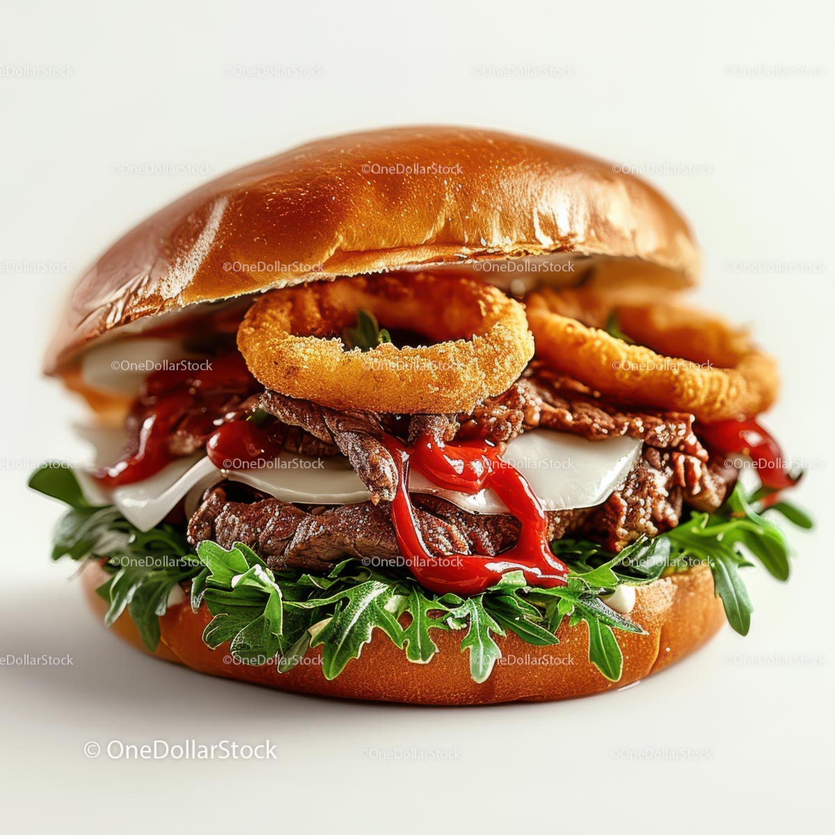Arugula-Topped Gourmet Burger with Crispy Onion Rings