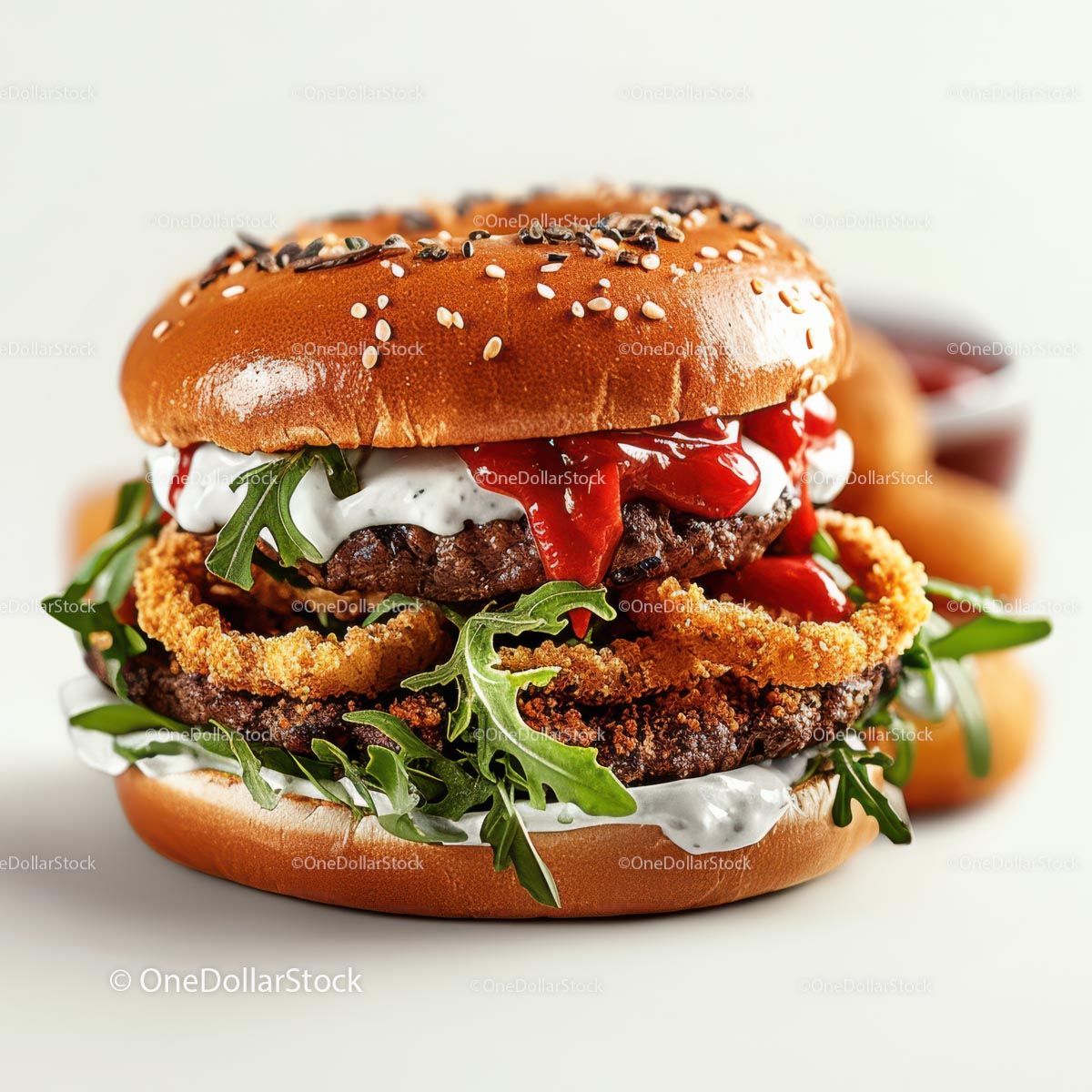 Gourmet Burger with Arugula and Onion Rings