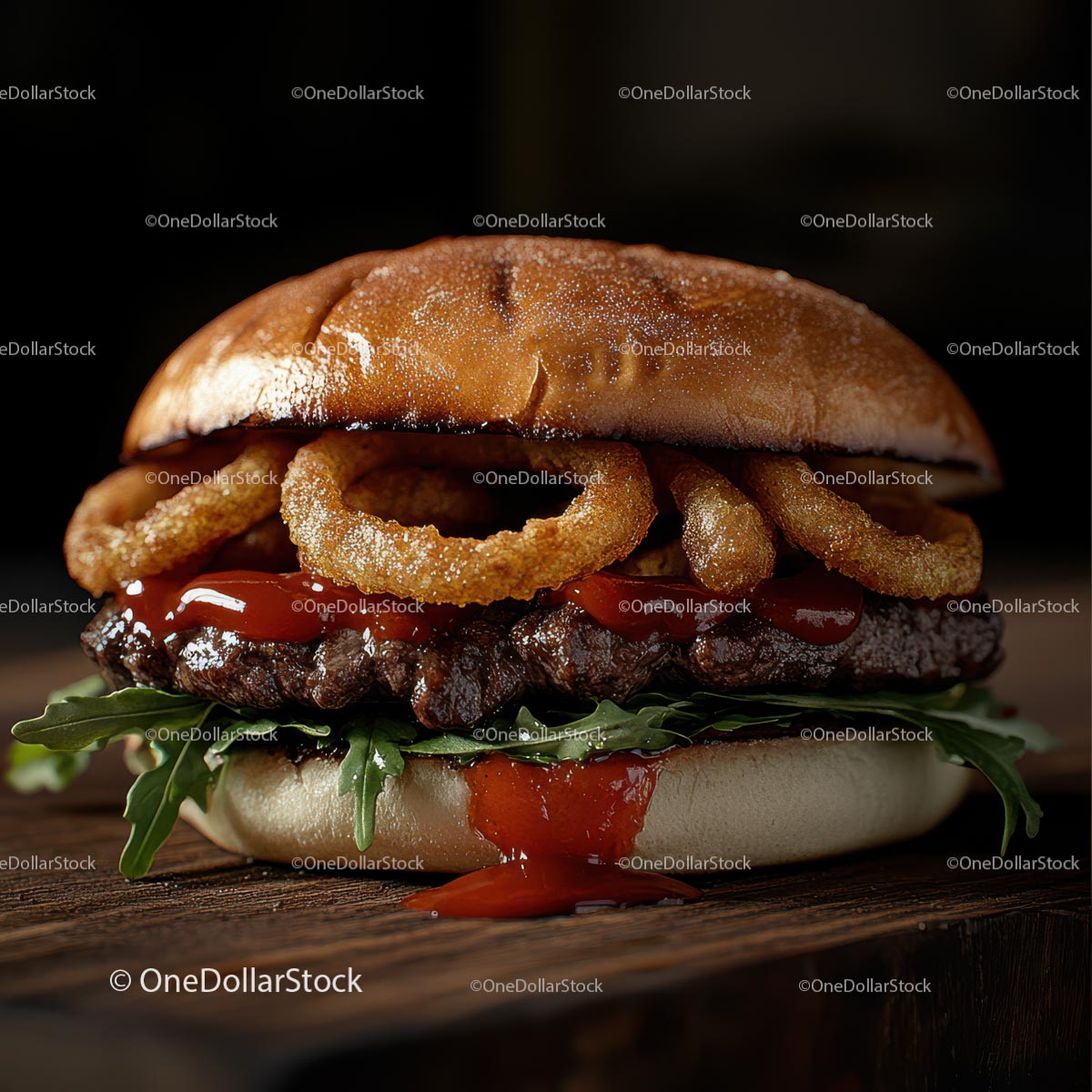 Gourmet Burger with Onion Rings and Arugula