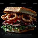 Gourmet Burger with Onion Rings and Arugula