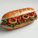 Gourmet Burger with Onion Rings and Arugula