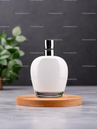Minimalist Perfume Bottle on Wooden Tray with Greenery