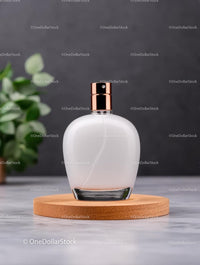 Elegant Perfume Bottle on Wooden Coaster with Greenery