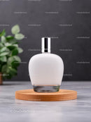 Minimalist Perfume Bottle on Wooden Tray with Greenery