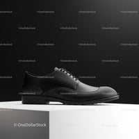 Elegant Black Leather Dress Shoe on White Pedestal