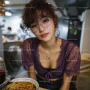 Young Woman Enjoying Ramen in a Cozy Cafe