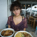Young Woman Dining in a Cozy Cafe