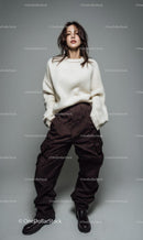 Confident Woman in White Sweater and Trendy Pants