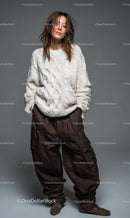 Stylish Woman in Cozy Knit Sweater and Brown Trousers