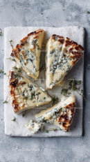 Gourmet Blue Cheese Slices on Marble Board