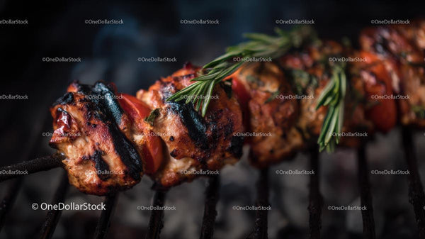 Grilled Meat Skewer with Rosemary on a Barbecue