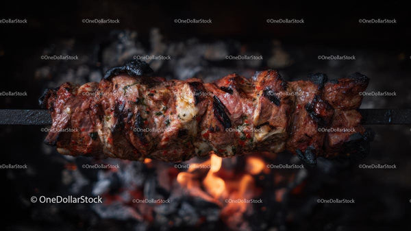 Juicy Marinated Meat Grilling Over Open Flames