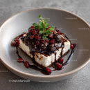 Creamy Cheesecake with Berry and Mint Topping
