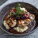 Roasted Chicken with Berry Garnish on Mashed Potatoes