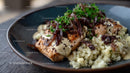 Salmon with Quinoa and Caramelized Onions on a Plate