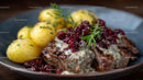 Juicy Steak with Cranberries and Rosemary on Plate
