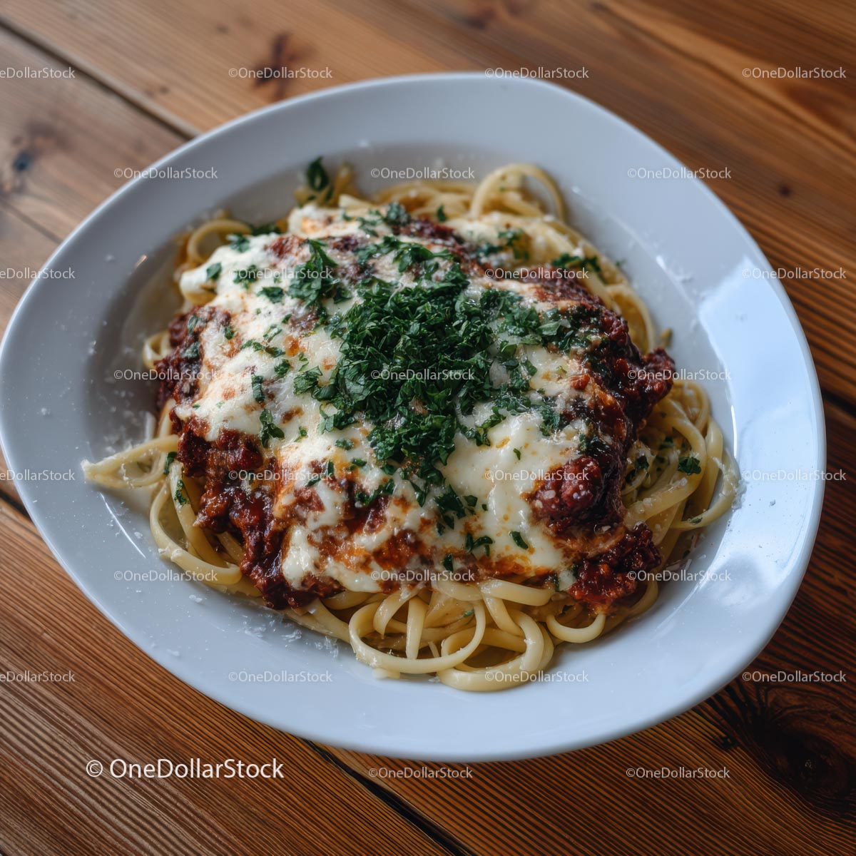 Spaghetti Bolognese with Fresh Herbs and Cheese on Wooden Table
