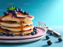 Stack of Blueberry Pancakes with Syrup and Fresh Mint