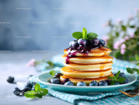 Stack of Pancakes with Blueberries and Syrup