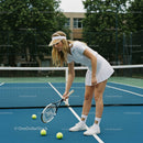 Female Tennis Player on Court in Athletic Attire
