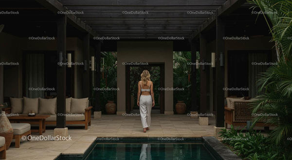 Elegant Tropical Patio with Lush Greenery and Pool