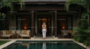 Woman Enjoying Tropical Villa Poolside Relaxation