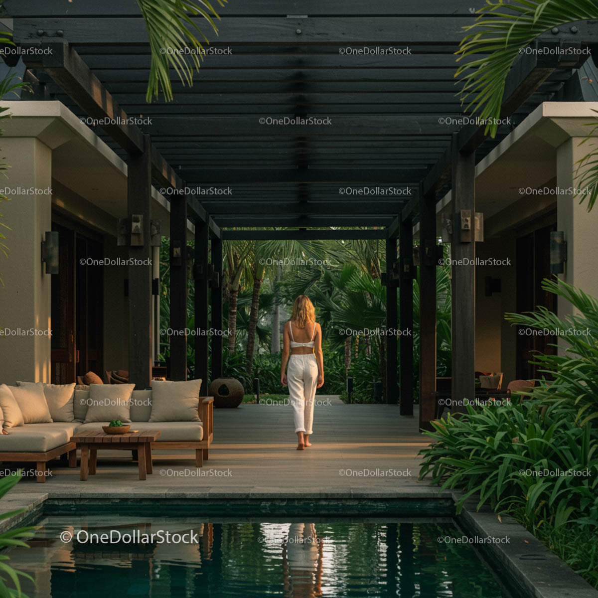 Woman Strolling Through Luxury Tropical Retreat