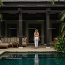 Woman in White Walking Poolside at Tropical Villa