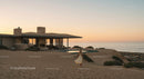 Coastal Home at Sunset with Woman Walking on Sandy Path