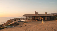 Modern Beach House at Sunset with Infinity Pool