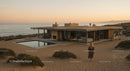 Modern Cliffside House with Glass Walls and Infinity Pool