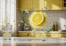 Fresh lemon splash with ice and rosemary in kitchen