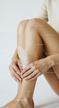 Elegant Woman with White Feather Focusing on Legs and Hands