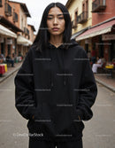 Fashionable Woman Wearing Black Hoodie in Urban City Street