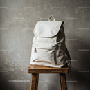 Minimalist White Backpack on Wooden Stool in Rustic Space